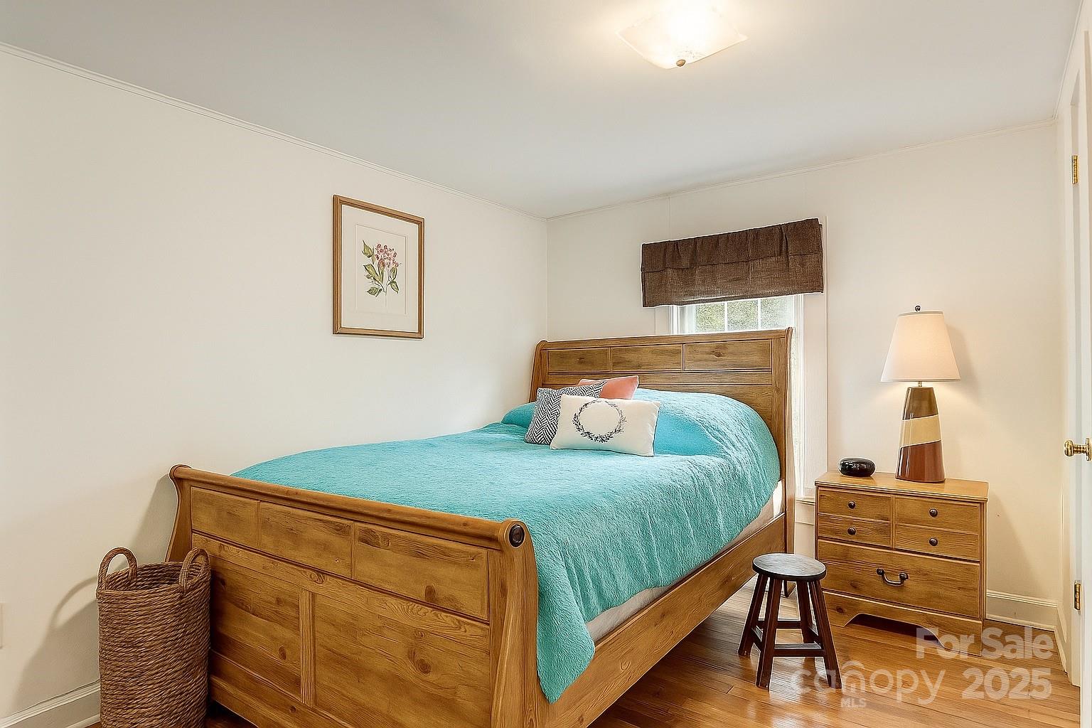 1639 Soco Road Maggie Valley, NC 28751 - Photo 12 of 15 a bedroom with a bed and a dresser