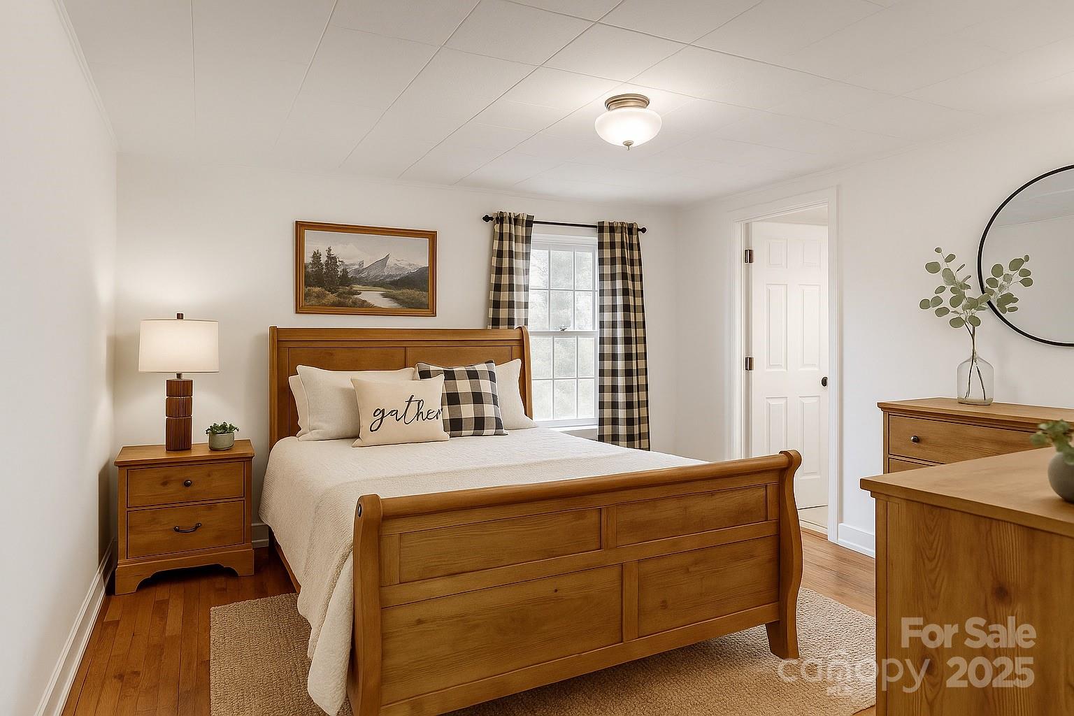 1639 Soco Road Maggie Valley, NC 28751 - Photo 13 of 15 a bedroom with a bed and a painting on the wall