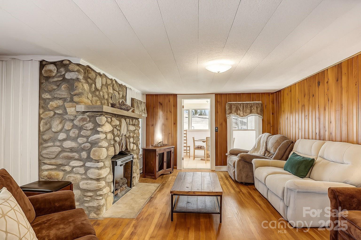 1639 Soco Road Maggie Valley, NC 28751 - Photo 2 of 15 a living room with furniture and a fireplace