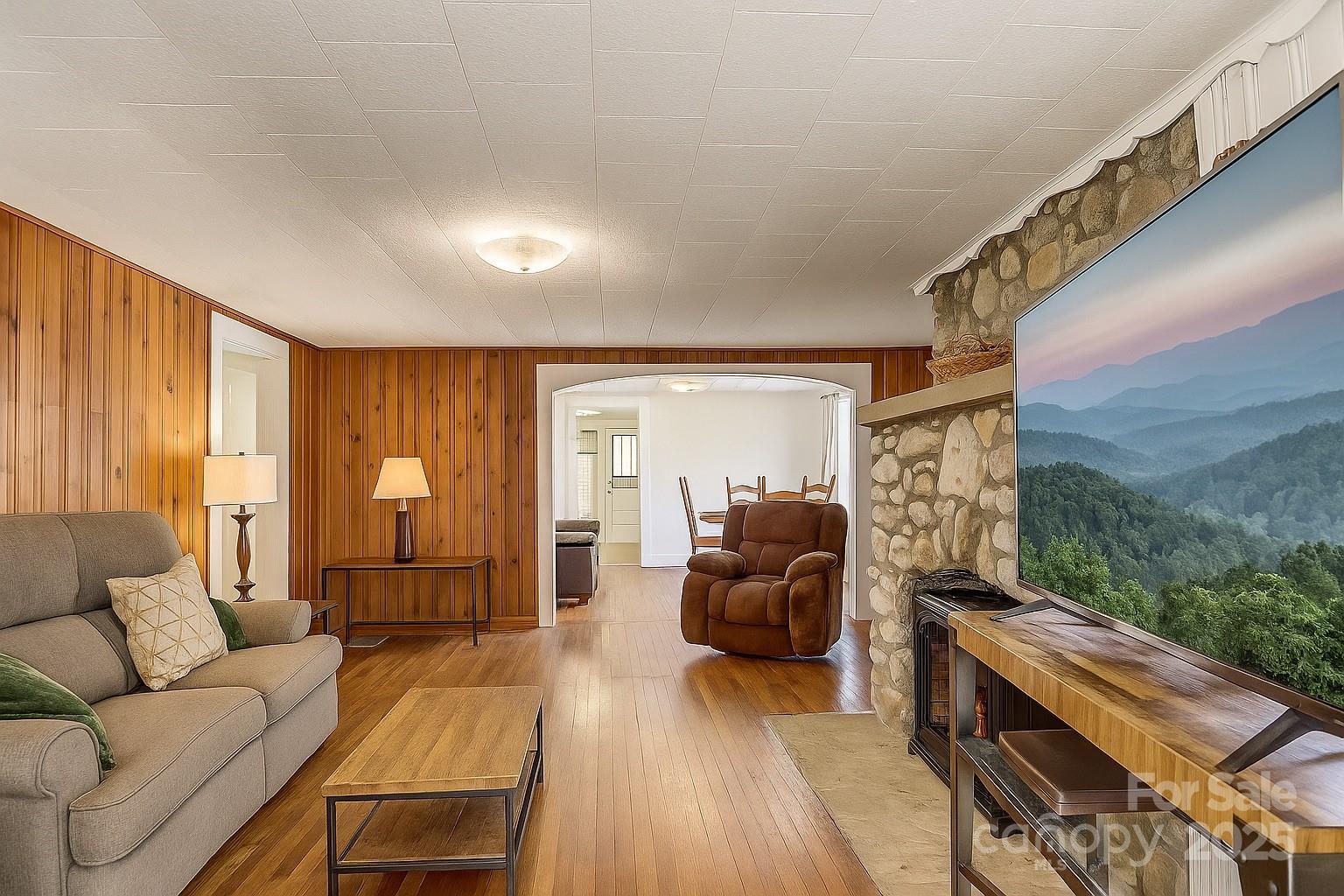1639 Soco Road Maggie Valley, NC 28751 - Photo 4 of 15 a living room with furniture and a fireplace