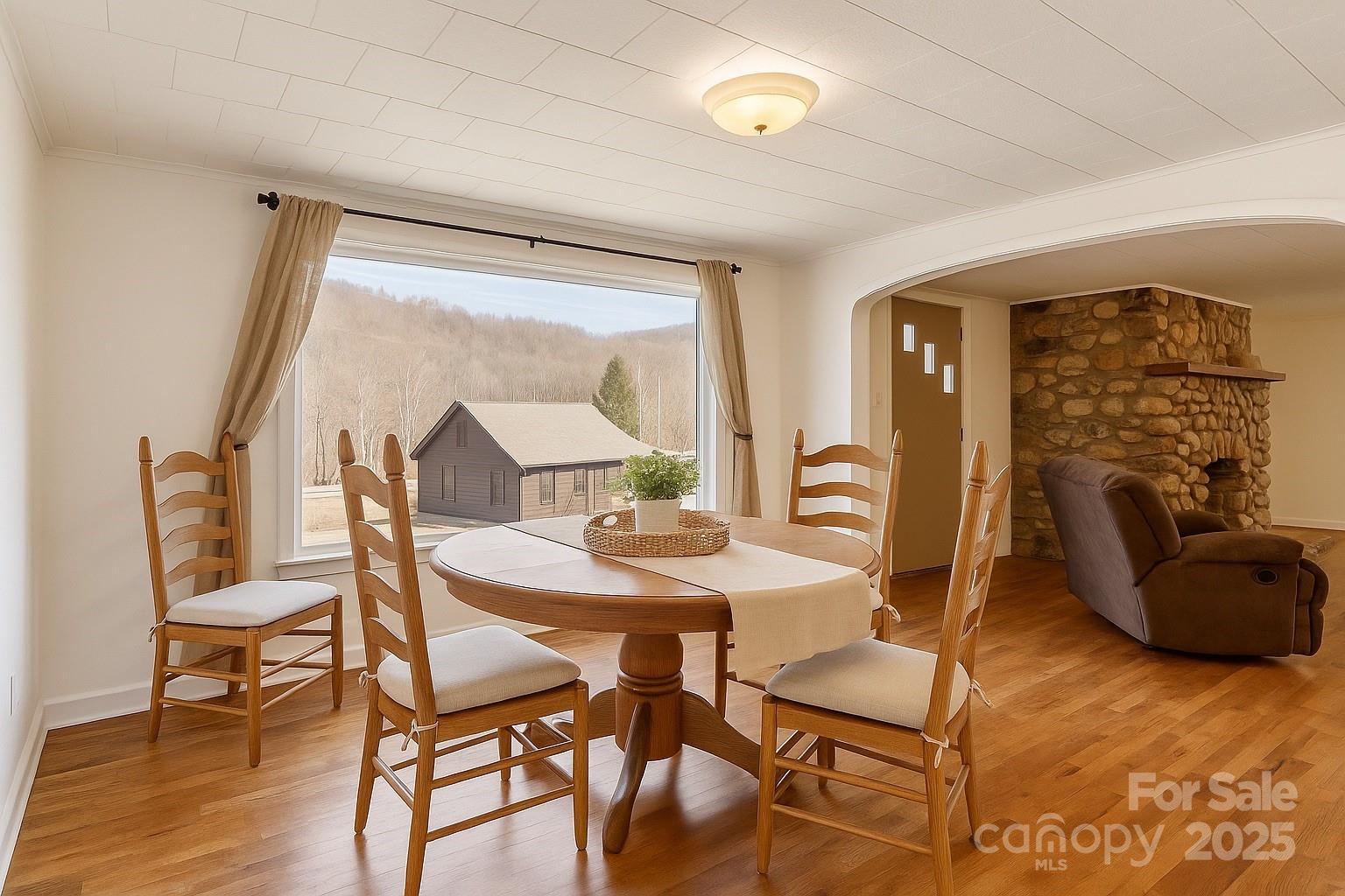 1639 Soco Road Maggie Valley, NC 28751 - Photo 5 of 15 a view of a dining room with furniture and wooden floor