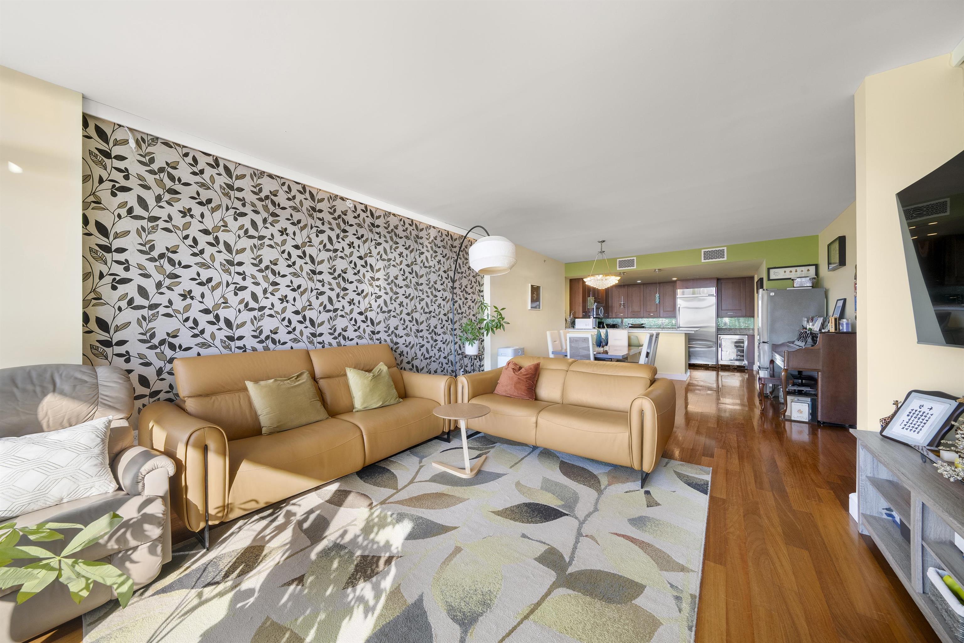 8100 River Road, Unit 1011 North Bergen, NJ 07047 - Photo 11 of 35 a living room with furniture and a flat screen tv