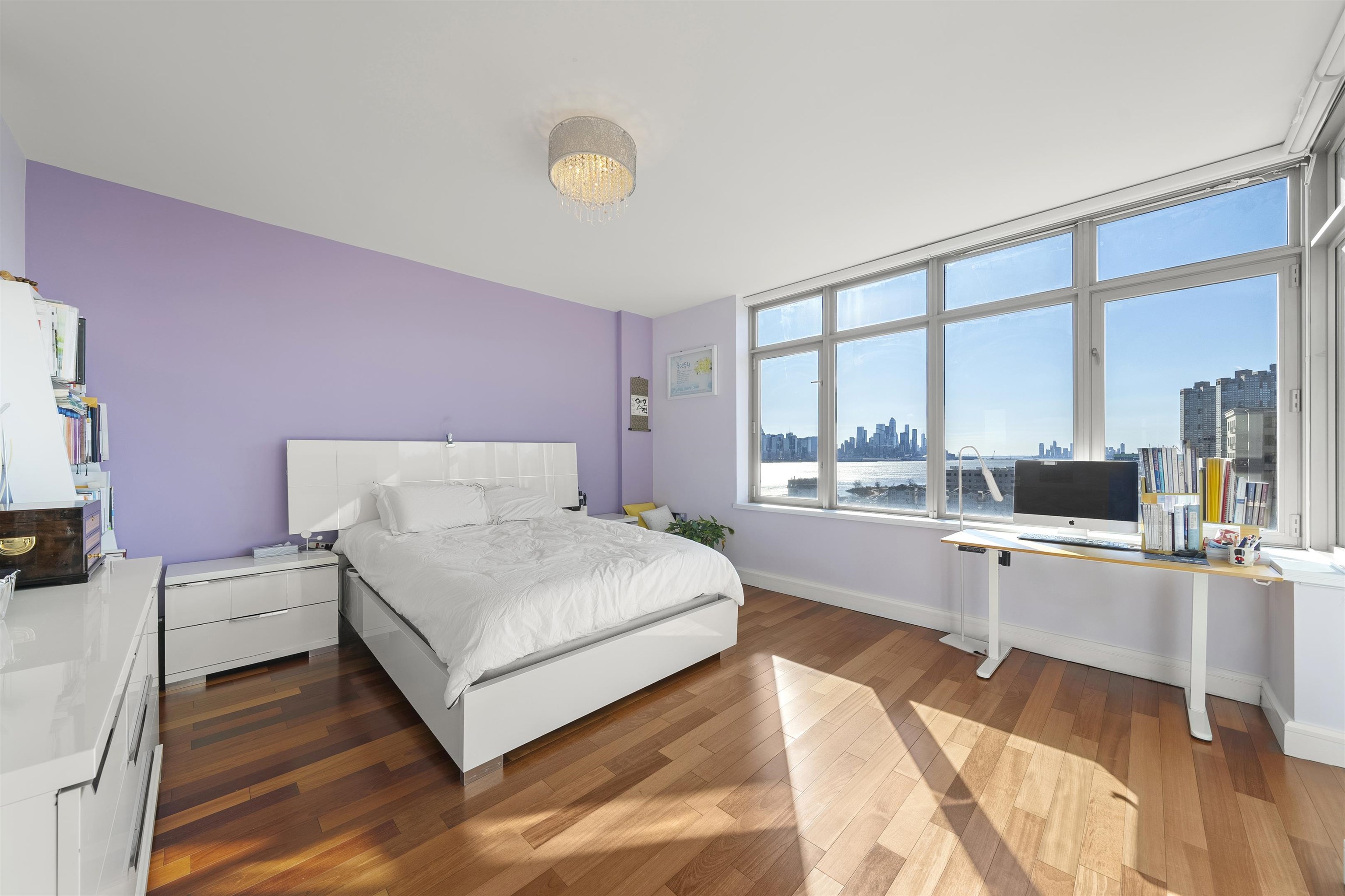 8100 River Road, Unit 1011 North Bergen, NJ 07047 - Photo 12 of 35 a spacious bedroom with a bed and large windows