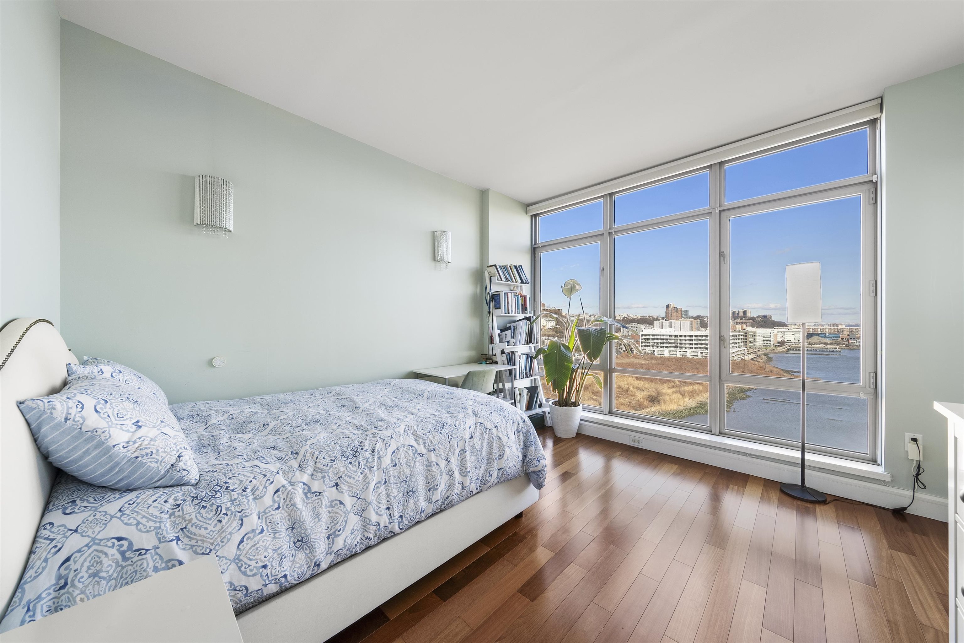 8100 River Road, Unit 1011 North Bergen, NJ 07047 - Photo 16 of 35 a bedroom with a bed and wooden floor