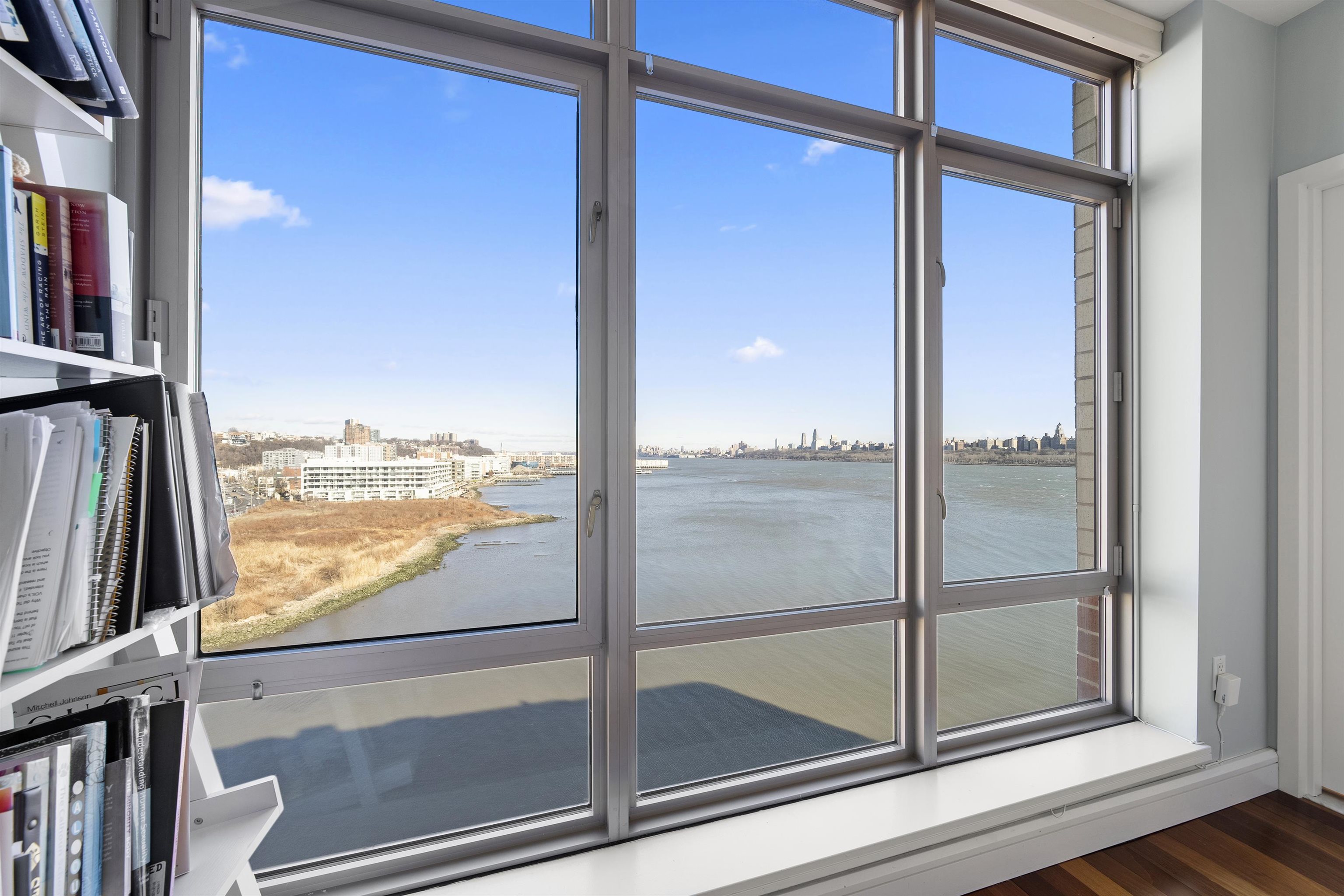 8100 River Road, Unit 1011 North Bergen, NJ 07047 - Photo 17 of 35 a view of a glass door with a from chair