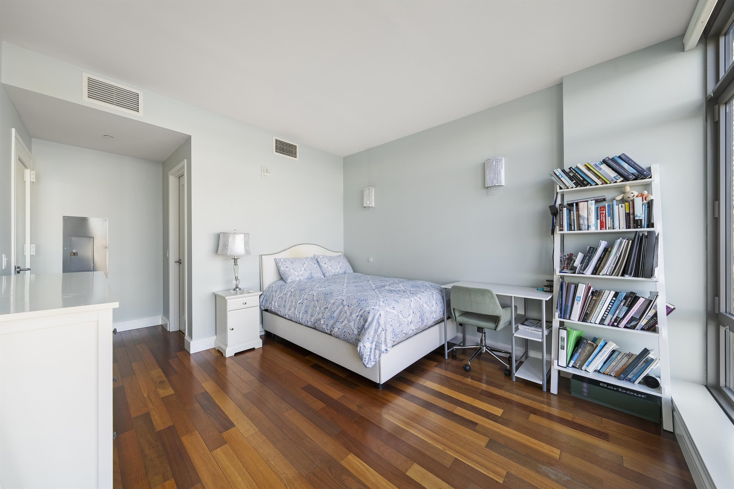 8100 River Road, Unit 1011 North Bergen, NJ 07047 - Photo 18 of 35 a bedroom with a bed and a book shelf