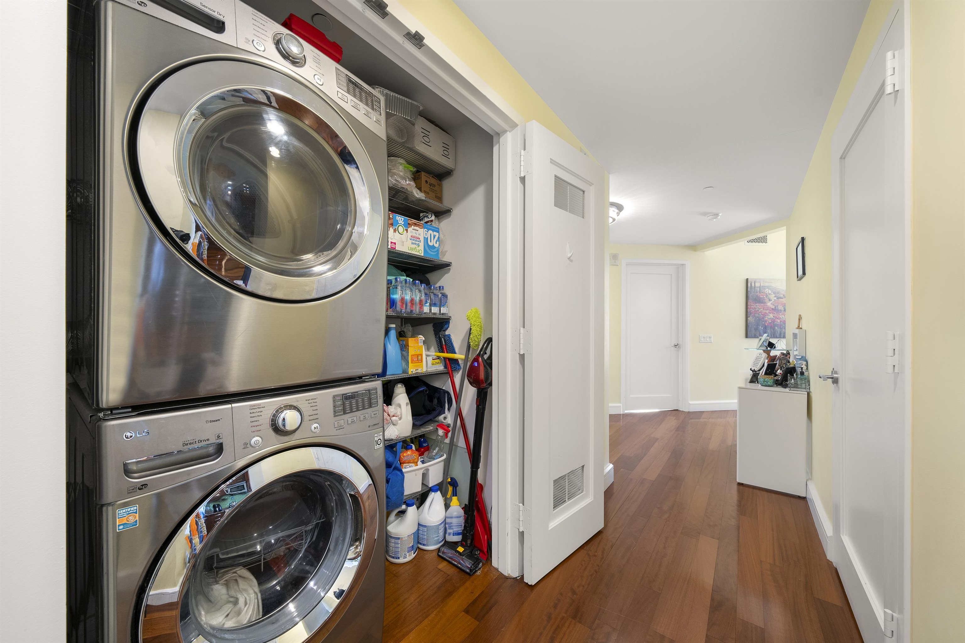 8100 River Road, Unit 1011 North Bergen, NJ 07047 - Photo 22 of 35 a view of a hallway with washer and dryer