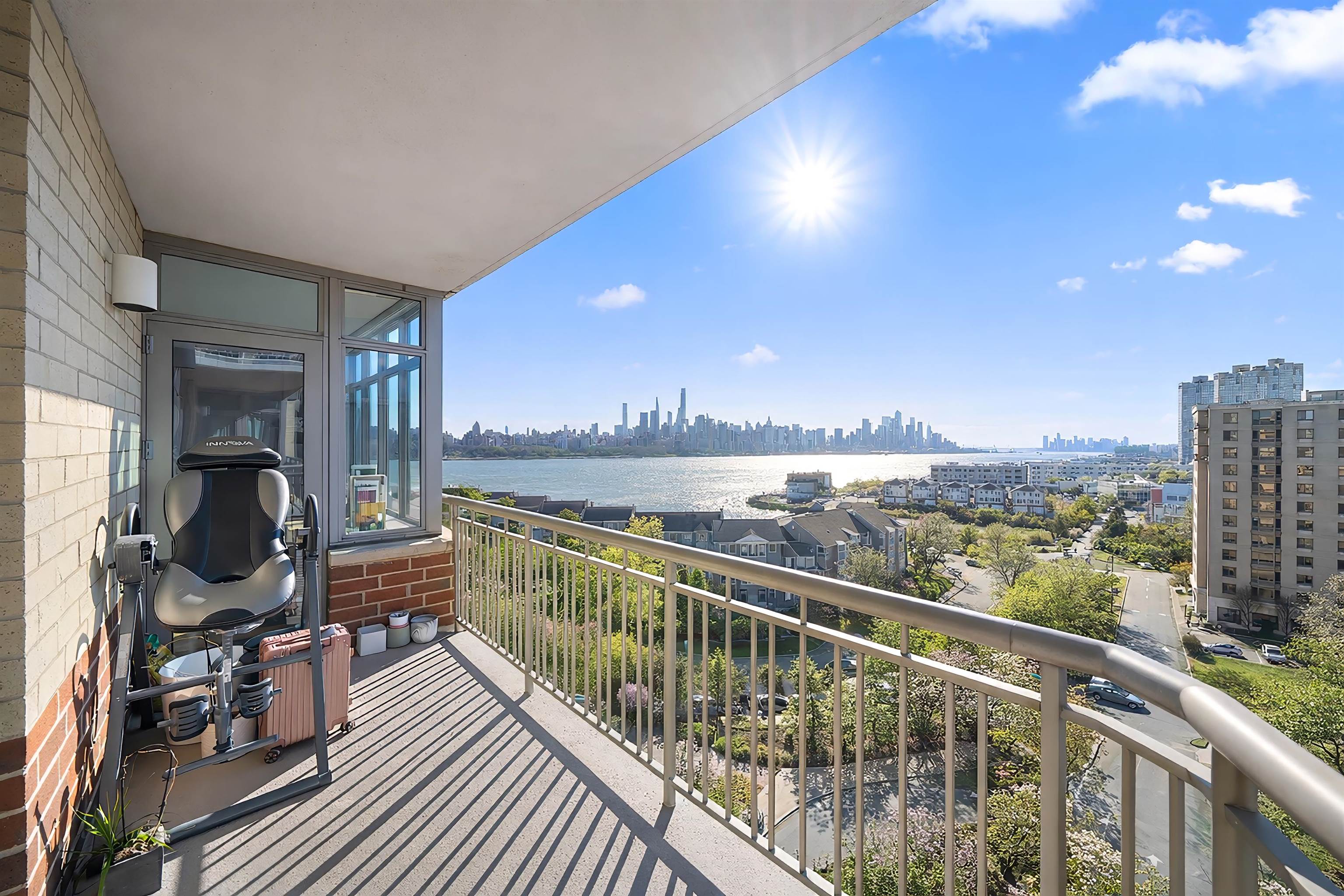 8100 River Road, Unit 1011 North Bergen, NJ 07047 - Photo 24 of 35 a view of a balcony with chair and wooden floor