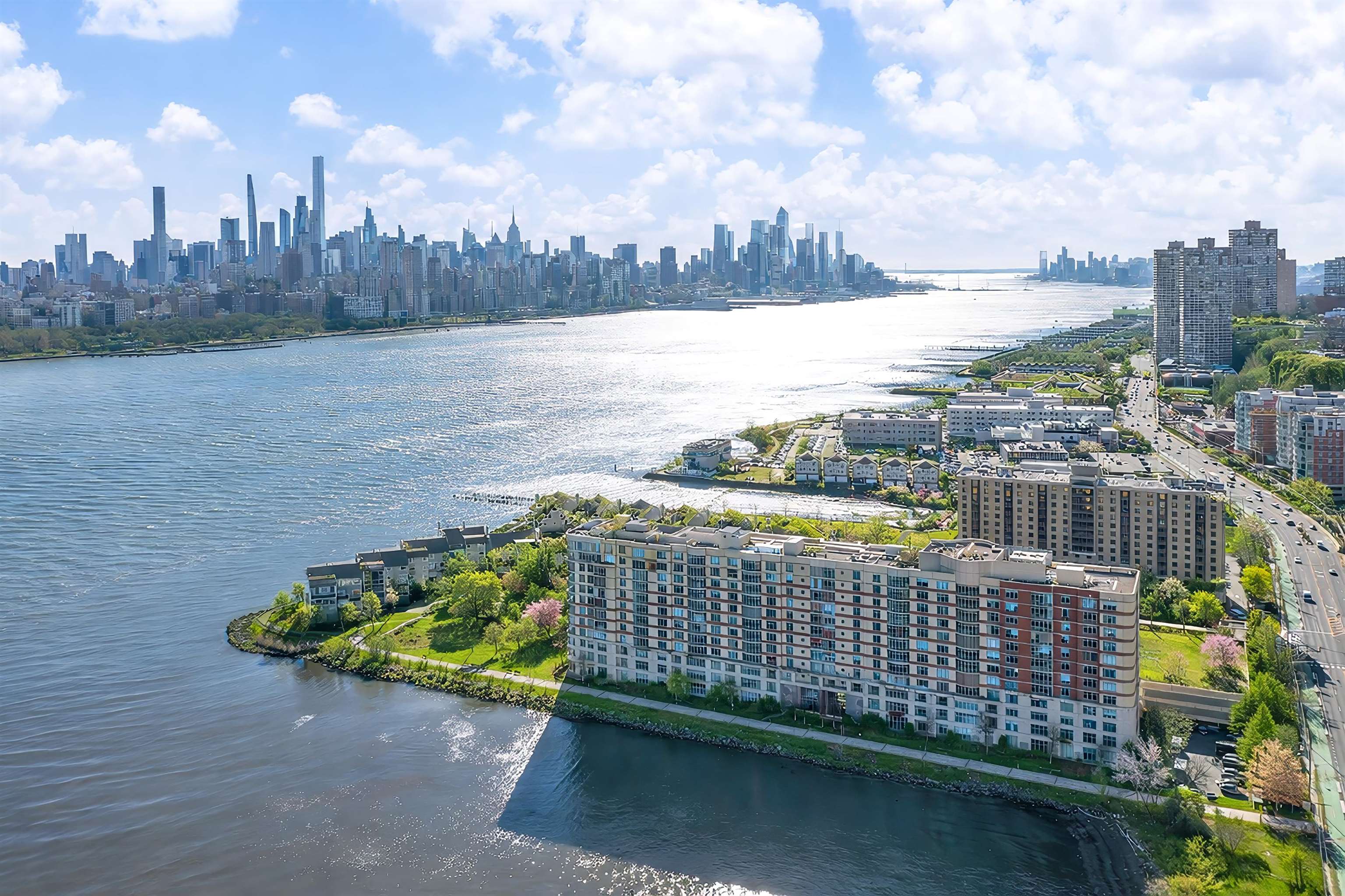 8100 River Road, Unit 1011 North Bergen, NJ 07047 - Photo 28 of 35 a street view with tall buildings