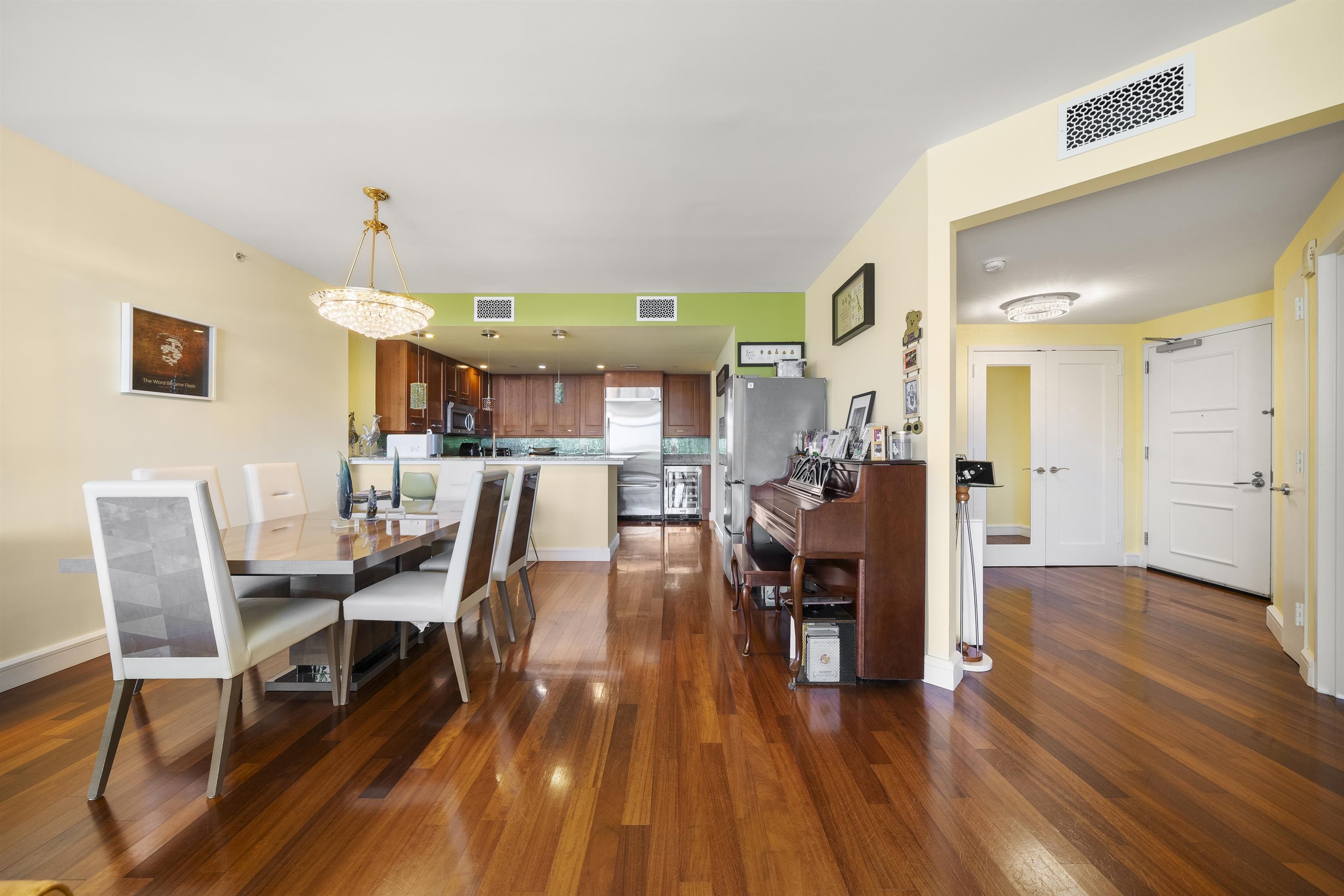 8100 River Road, Unit 1011 North Bergen, NJ 07047 - Photo 3 of 35 a dining room with furniture and wooden floor
