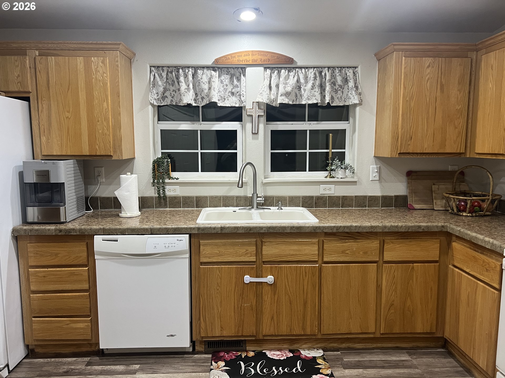 210 Northwest Grinstead Street Siletz, OR 97380 - Photo 12 of 29 a kitchen with granite countertop a sink and cabinets
