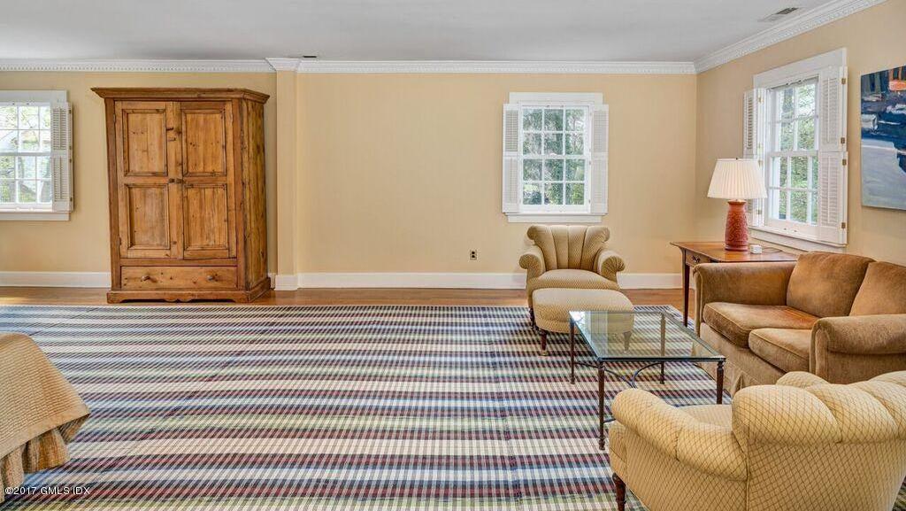 569 Indian Field Road Greenwich, CT 06830 - Photo 23 of 49 a living room with furniture and windows