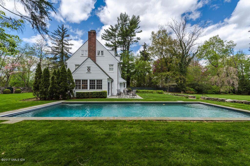 569 Indian Field Road Greenwich, CT 06830 - Photo 4 of 49 a front view of a house with swimming pool