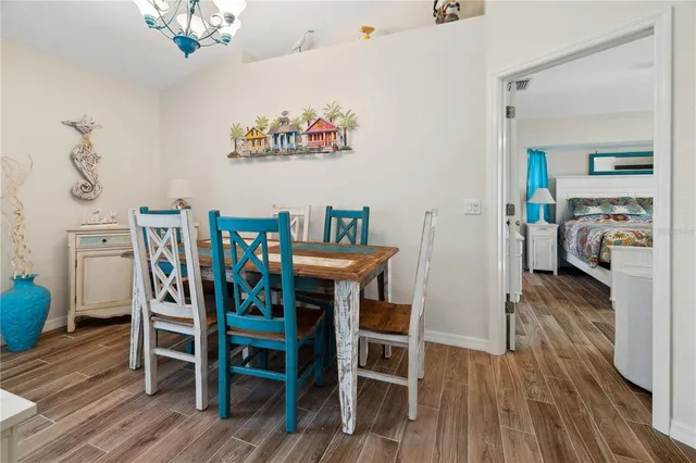 a view of a dining room with furniture and wooden floor