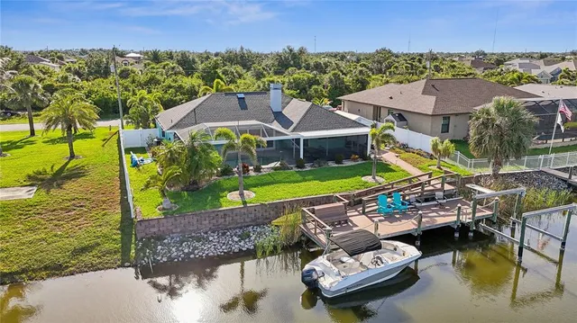 a view of a swimming pool with a patio
