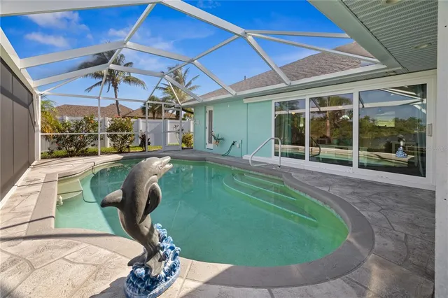 a swimming pool with outdoor seating and yard