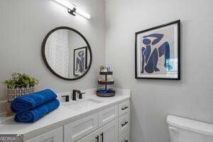 2328 Mason Drive Atlanta, GA 30316 - Photo 13 of 40 a bathroom with a toilet a sink and a mirror