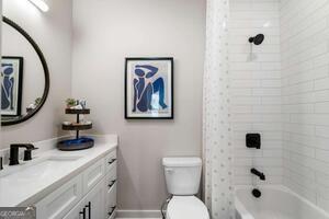2328 Mason Drive Atlanta, GA 30316 - Photo 14 of 40 a bathroom with a toilet a sink and mirror