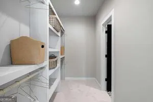 a view of entryway and kitchen