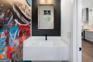 a bathroom with a sink and a mirror