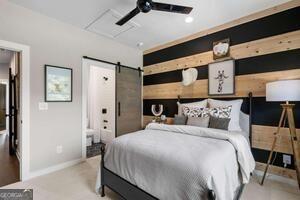 2328 Mason Drive Atlanta, GA 30316 - Photo 24 of 40 a bedroom with a large bed and a chandelier