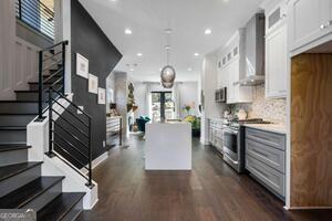 2328 Mason Drive Atlanta, GA 30316 - Photo 27 of 40 a large kitchen with stainless steel appliances lots of counter space and windows