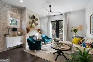 a view of a livingroom with furniture and windows