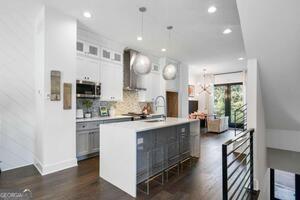 2328 Mason Drive Atlanta, GA 30316 - Photo 36 of 40 a kitchen with sink cabinets and living room view