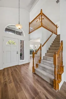 a view of an entryway with wooden floor