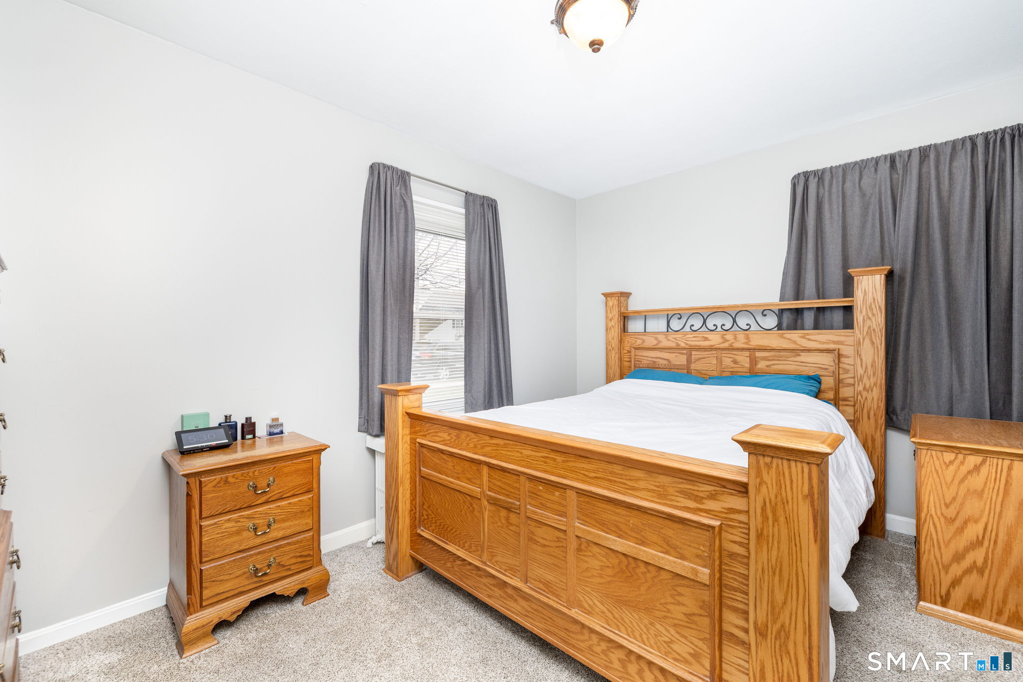 80 West Street Windsor Locks, CT 06096 - Photo 11 of 38 a bedroom with a bed and a cabinets