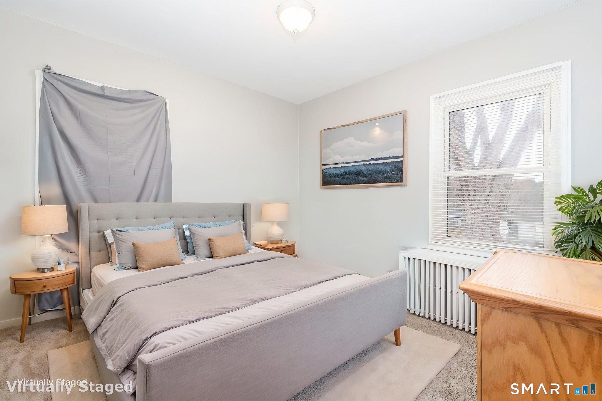 80 West Street Windsor Locks, CT 06096 - Photo 15 of 38 a bedroom with a bed a mirror and a window