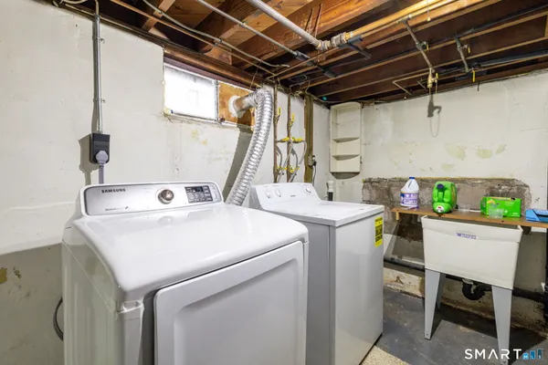 a utility room with dryer and washer