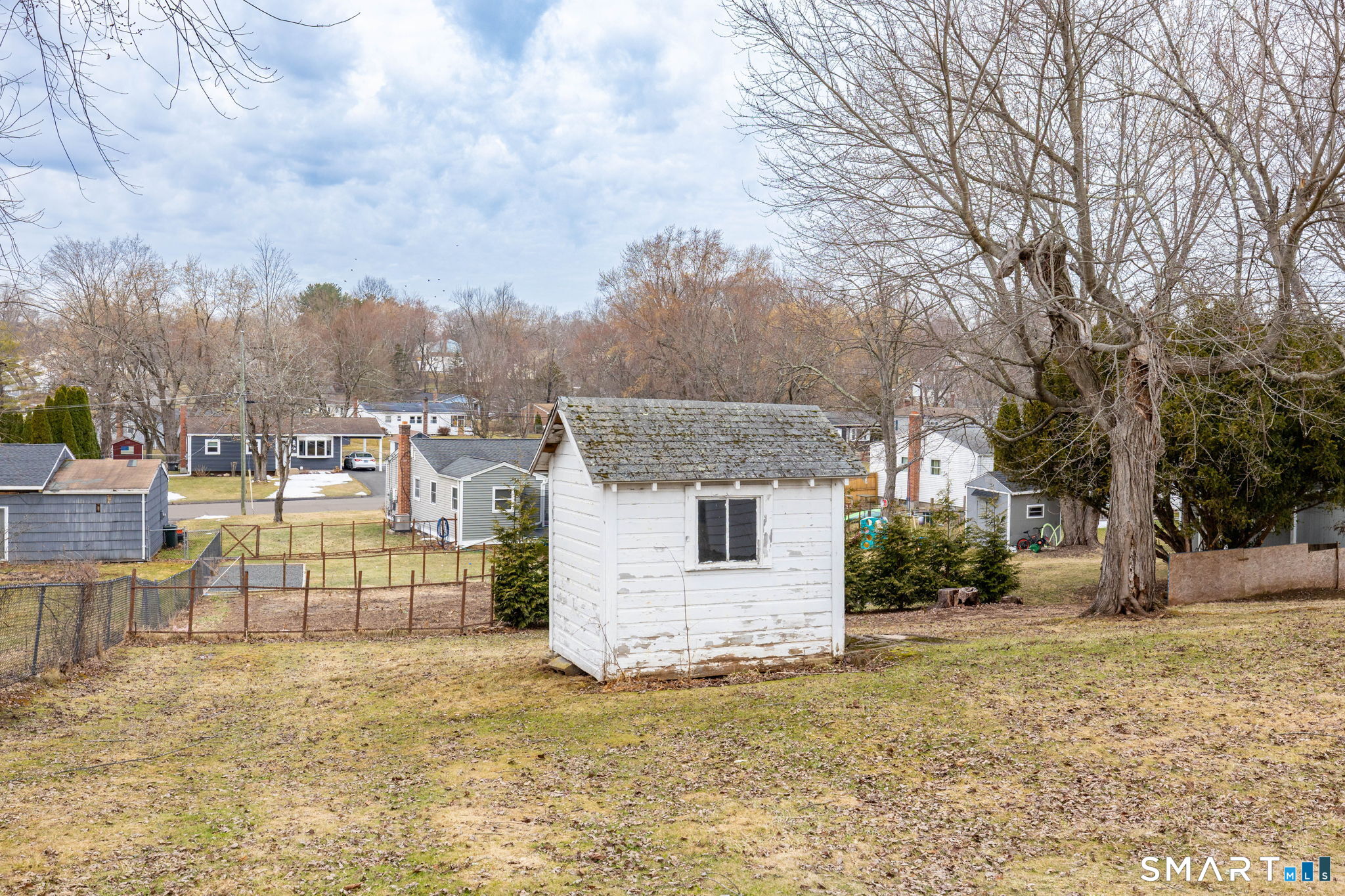 80 West Street Windsor Locks, CT 06096 - Photo 27 of 38 a view of a backyard with large trees
