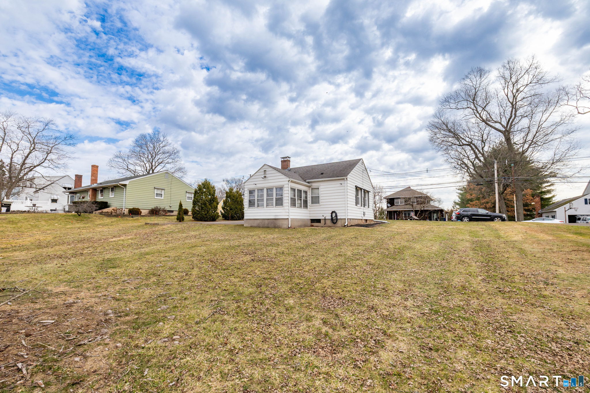 80 West Street Windsor Locks, CT 06096 - Photo 28 of 38 a view of house with yard and car parked