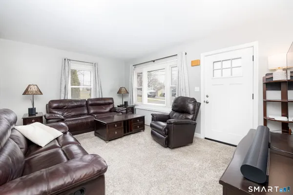 a living room with furniture and a window
