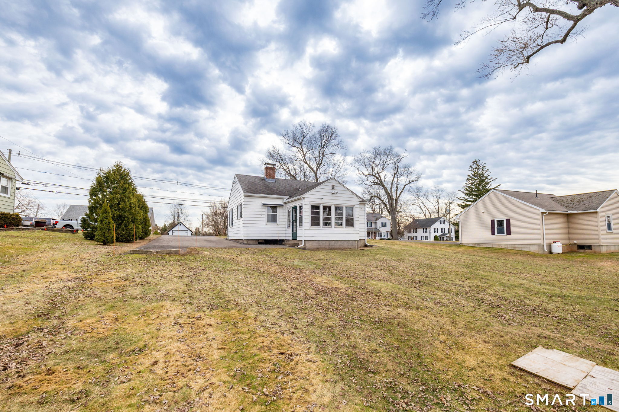 80 West Street Windsor Locks, CT 06096 - Photo 31 of 38 a front view of a house with a yard and garage