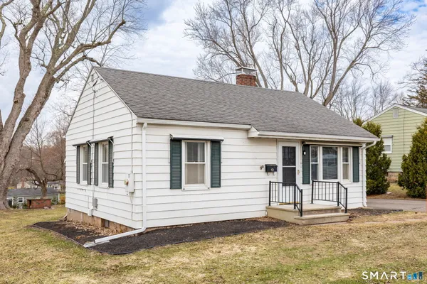 a house with trees in front of it