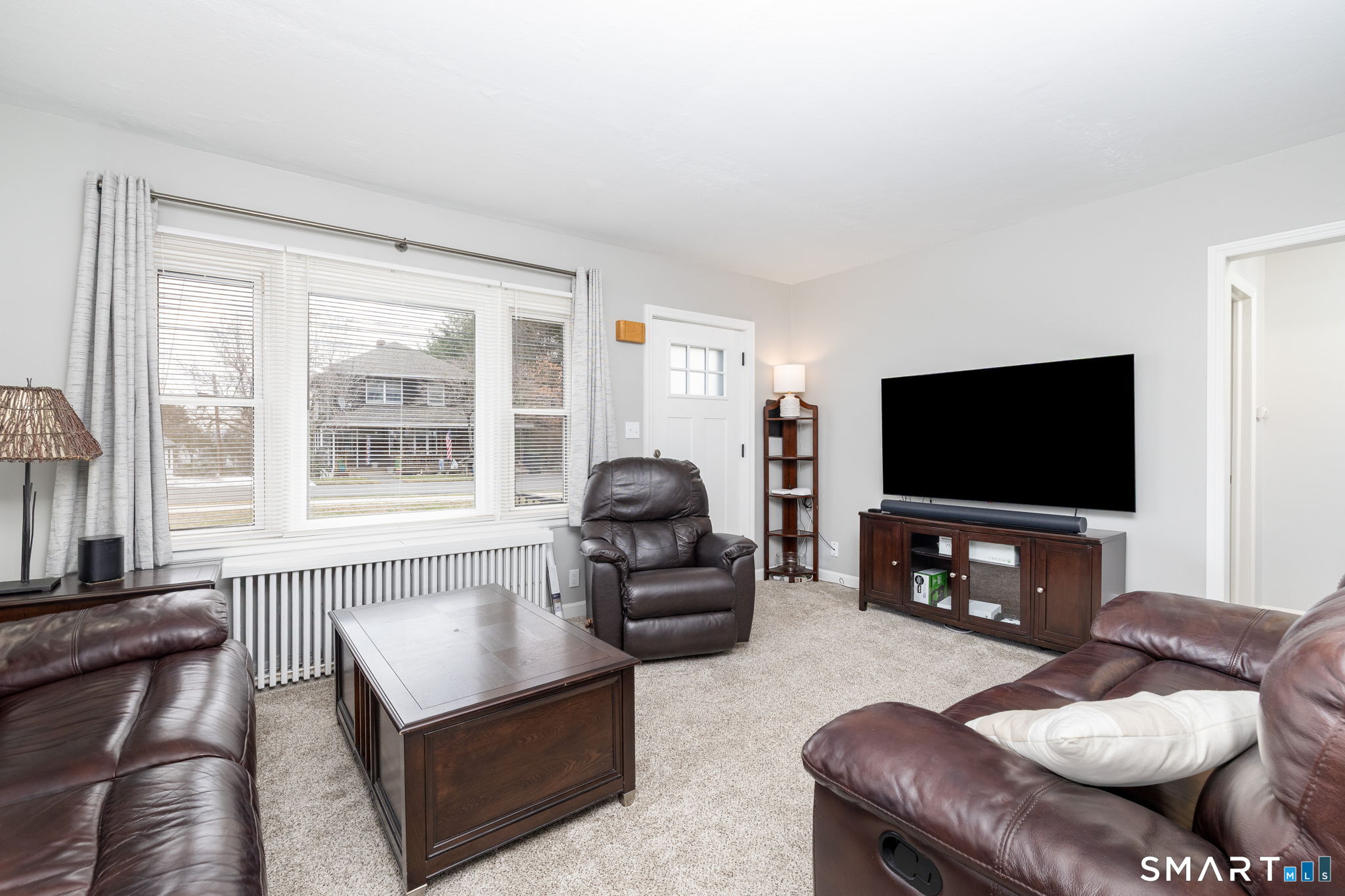80 West Street Windsor Locks, CT 06096 - Photo 5 of 38 a living room with furniture and a flat screen tv