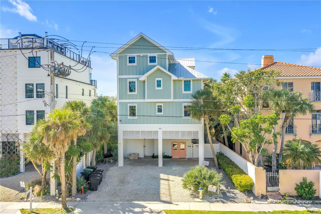 316 Beach Road Sarasota, FL 34242 - Photo 1 of 98 a front view of a house with a yard