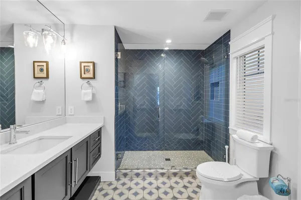 a bedroom with a bed and a view of bathroom