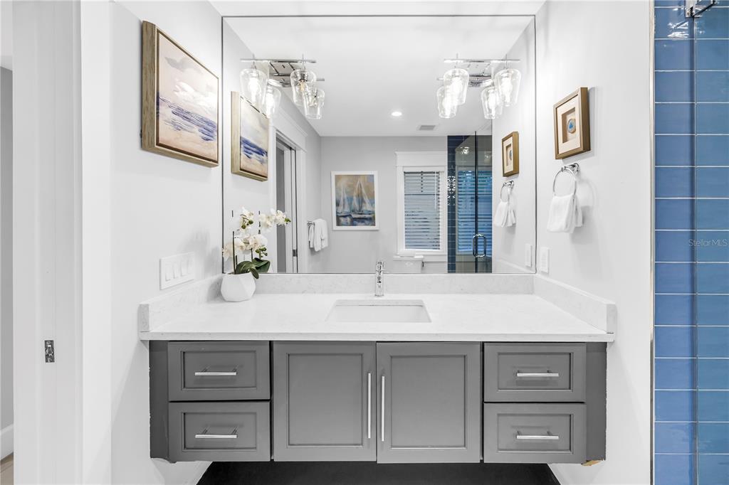 316 Beach Road Sarasota, FL 34242 - Photo 14 of 98 a bathroom with a sink vanity and a mirror