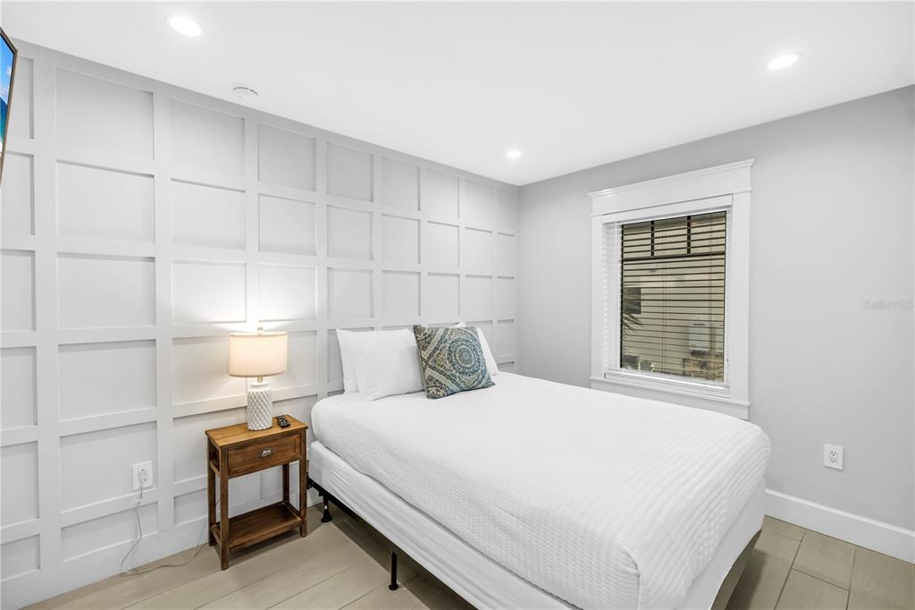 316 Beach Road Sarasota, FL 34242 - Photo 19 of 98 a bedroom with a bed and a window
