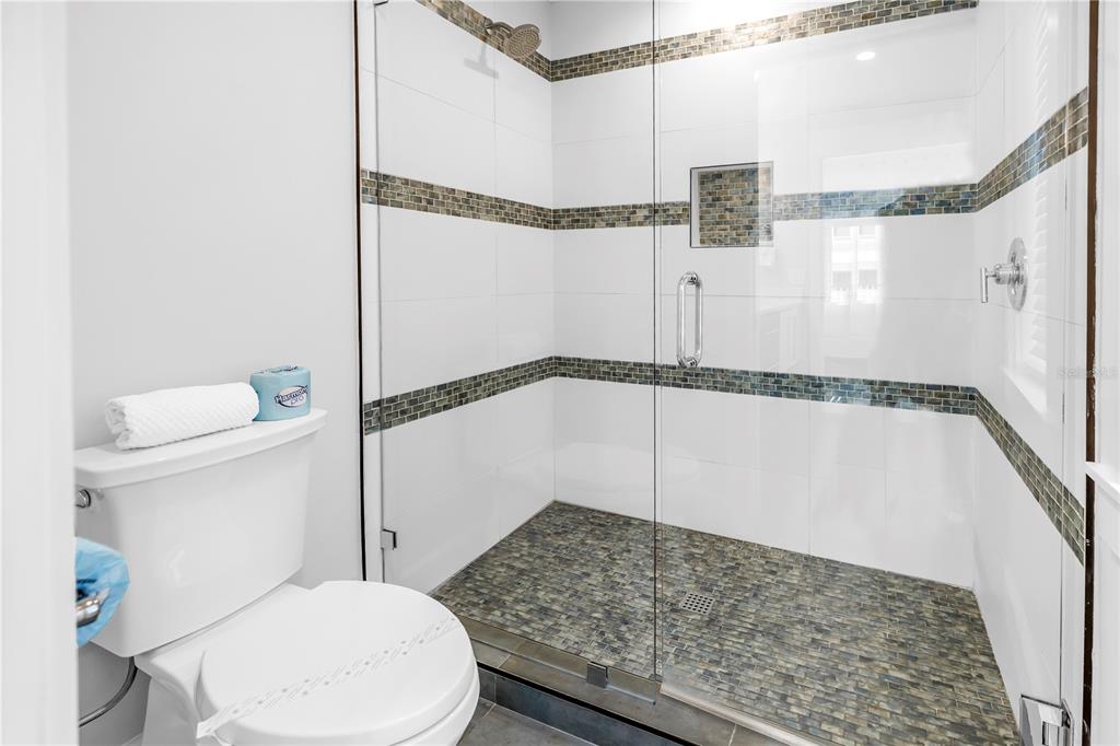 316 Beach Road Sarasota, FL 34242 - Photo 25 of 98 a bathroom with a toilet and a shower