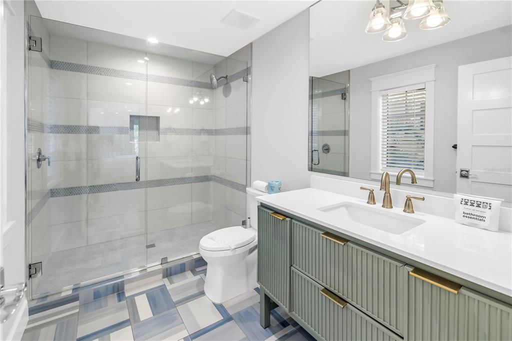 316 Beach Road Sarasota, FL 34242 - Photo 33 of 98 a bathroom with a sink toilet a mirror and shower