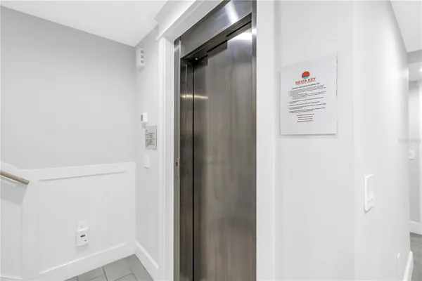 a white bath tub sitting next to a white sink