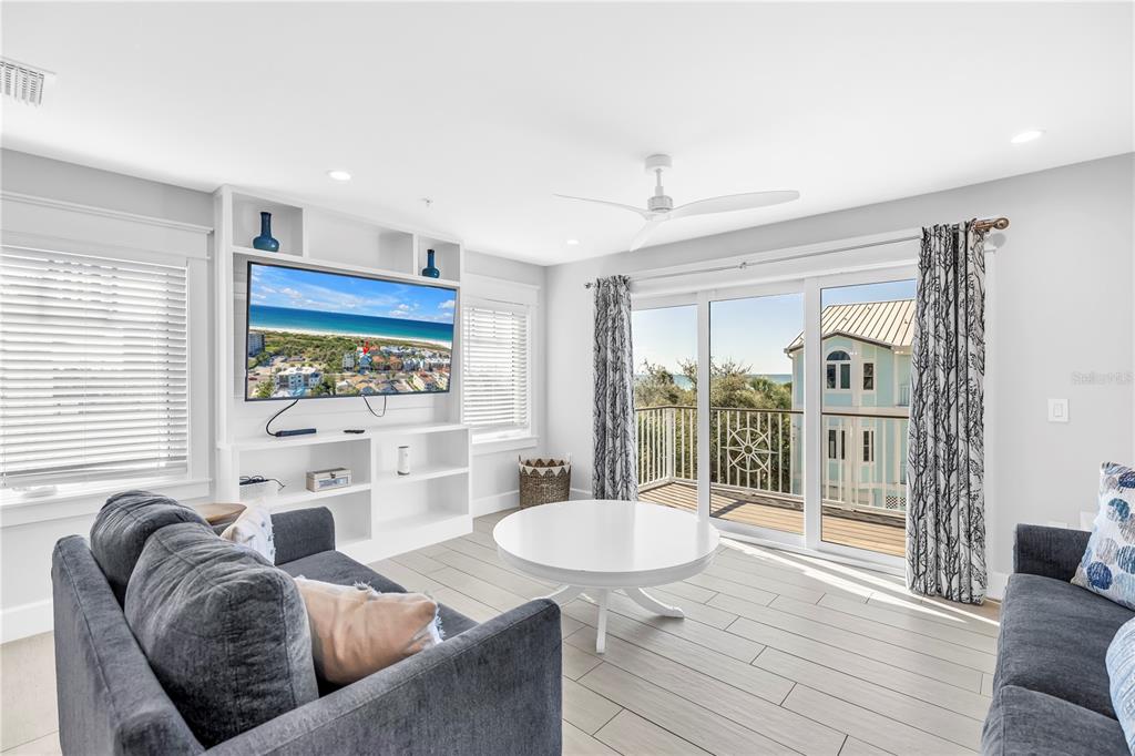 316 Beach Road Sarasota, FL 34242 - Photo 49 of 98 a living room with furniture and a table