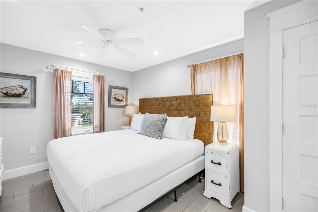 316 Beach Road Sarasota, FL 34242 - Photo 58 of 98 a bedroom with a large bed and a window