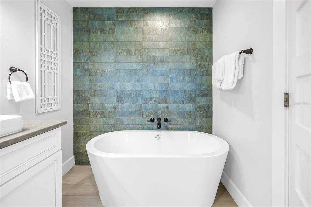 316 Beach Road Sarasota, FL 34242 - Photo 64 of 98 a white bath tub sitting next to a white sink