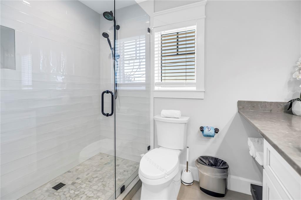 316 Beach Road Sarasota, FL 34242 - Photo 65 of 98 a bathroom with a granite countertop toilet and a sink