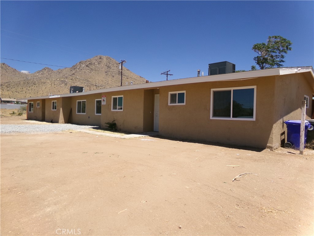 20448 Yuma Road Apple Valley, CA 92307 - Photo 1 of 1 a view of a house with a yard